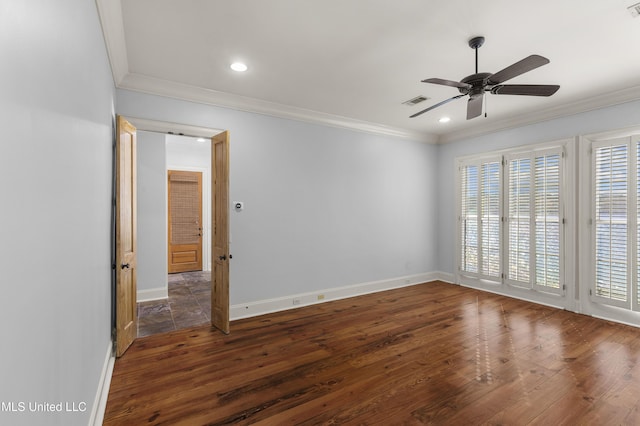 empty room featuring crown molding, dark hardwood / wood-style flooring, and ceiling fan