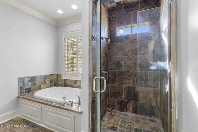 bathroom featuring ornamental molding and independent shower and bath