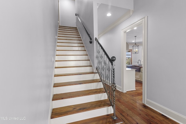 stairway featuring hardwood / wood-style flooring