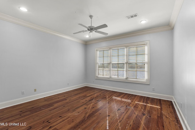 empty room with crown molding, dark hardwood / wood-style flooring, and ceiling fan