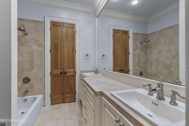 bathroom with tile patterned floors, vanity, ornamental molding, and tiled shower / bath