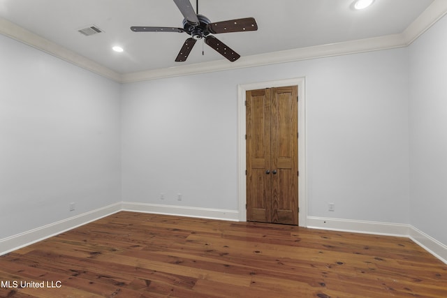 unfurnished room featuring crown molding, hardwood / wood-style floors, and ceiling fan