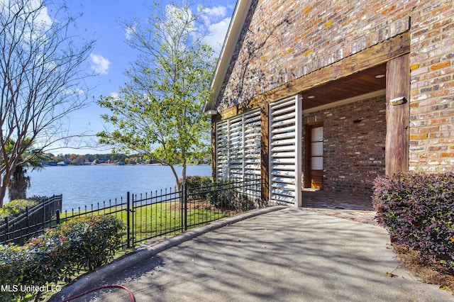 view of patio with a water view