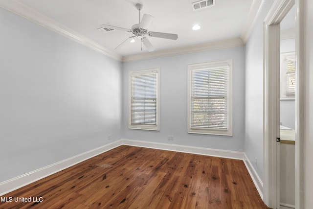 empty room featuring ceiling fan, ornamental molding, and hardwood / wood-style flooring