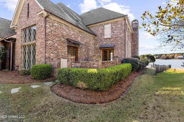 view of home's exterior with a yard