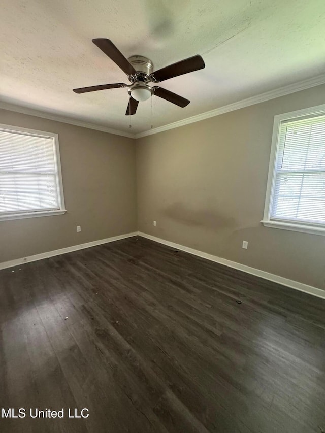 1010 Deryll St, Jackson, MS 39212 - unfurnished room with plenty of natural light, dark wood finished floors, ornamental molding, and baseboards
