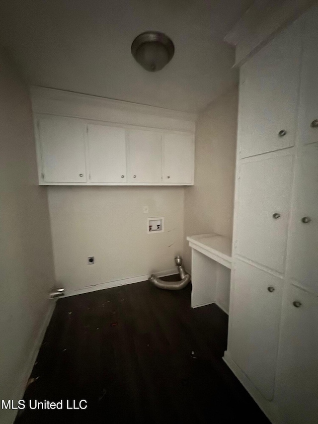 1010 Deryll St, Jackson, MS 39212 - laundry area featuring washer hookup, dark wood-style flooring, cabinet space, and baseboards