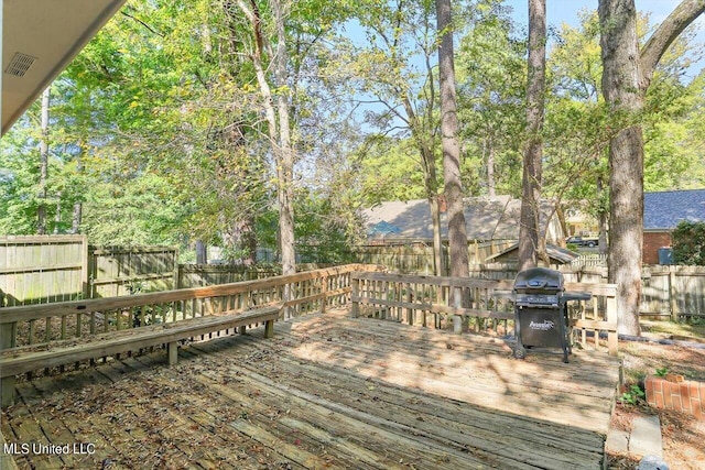 wooden terrace featuring grilling area