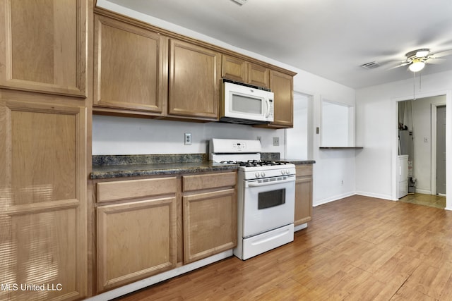 kitchen featuring gas water heater, light wood-type flooring, ceiling fan, and white appliances