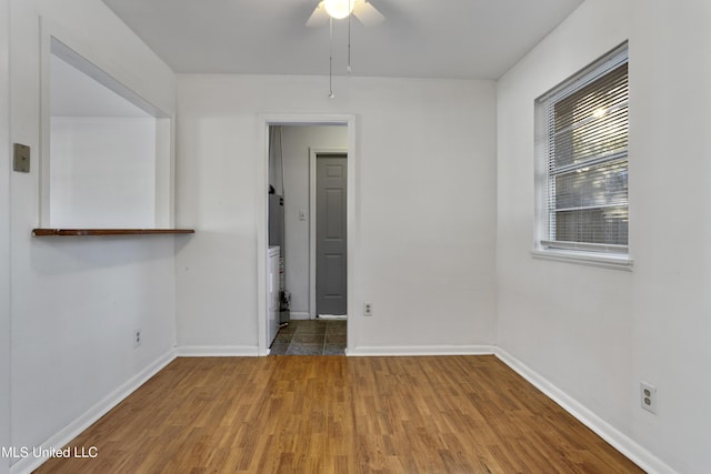 spare room with wood-type flooring and ceiling fan