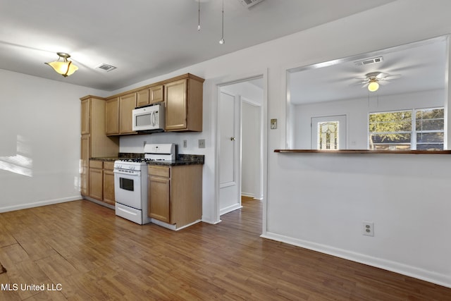 kitchen with ceiling fan, white appliances, and hardwood / wood-style floors