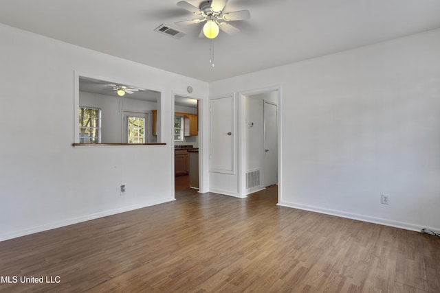 unfurnished room with hardwood / wood-style floors and ceiling fan