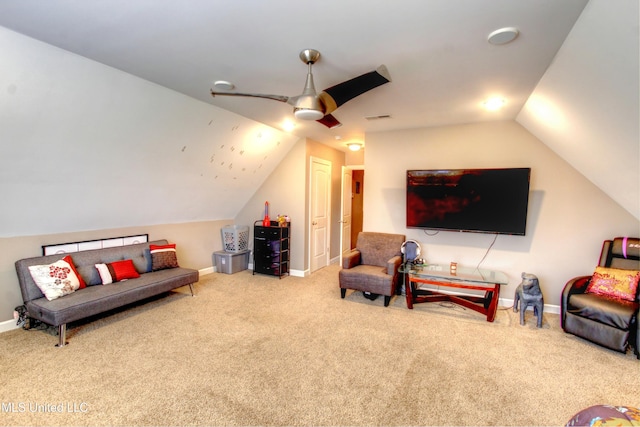 carpeted living area featuring vaulted ceiling, a ceiling fan, visible vents, and baseboards