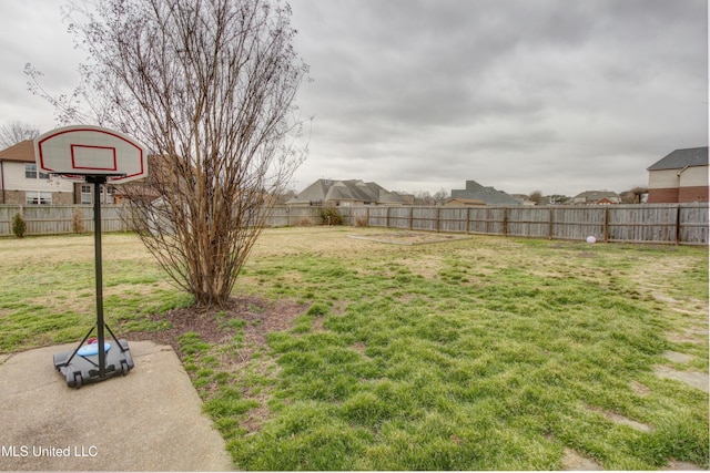 view of yard with a fenced backyard