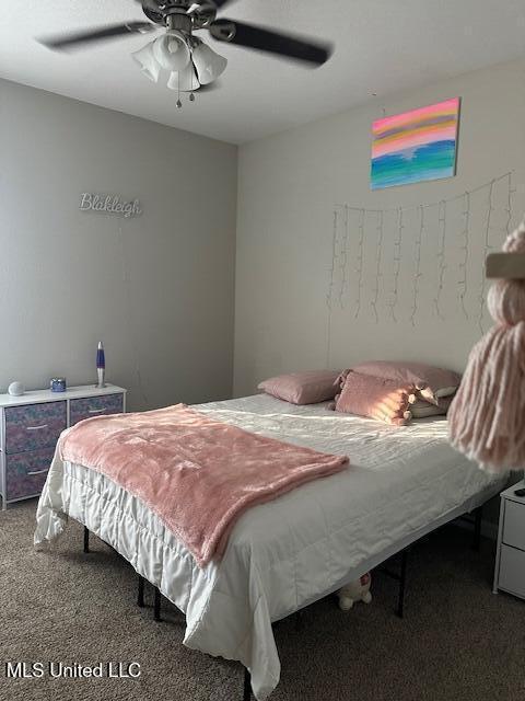 carpeted bedroom featuring ceiling fan