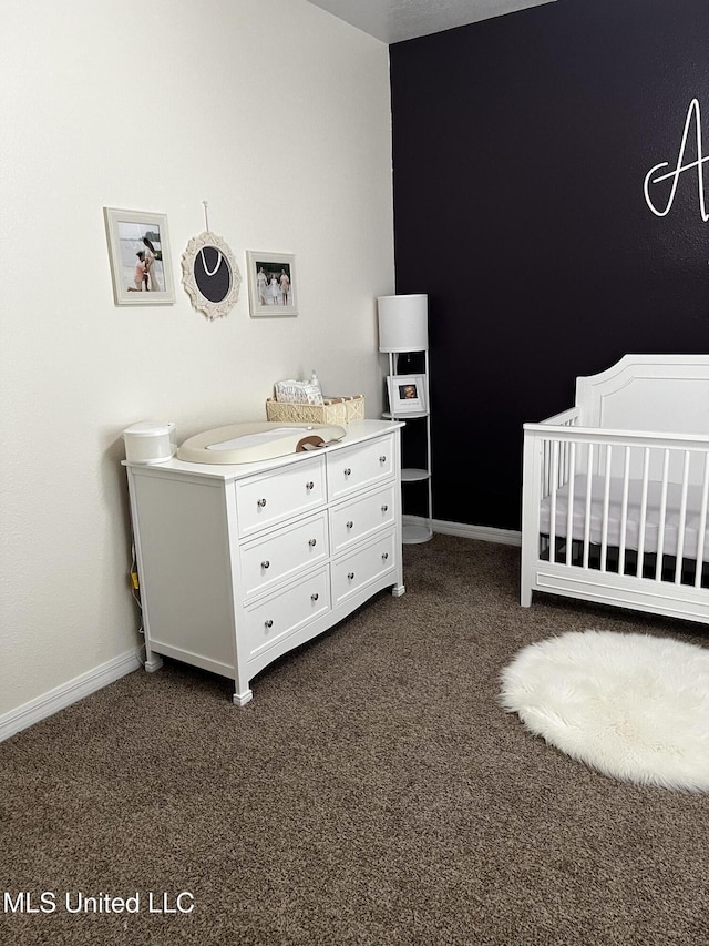 carpeted bedroom with a crib