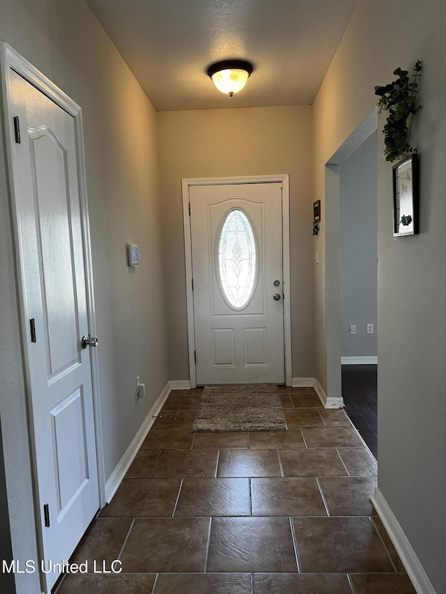 entrance foyer featuring a textured ceiling