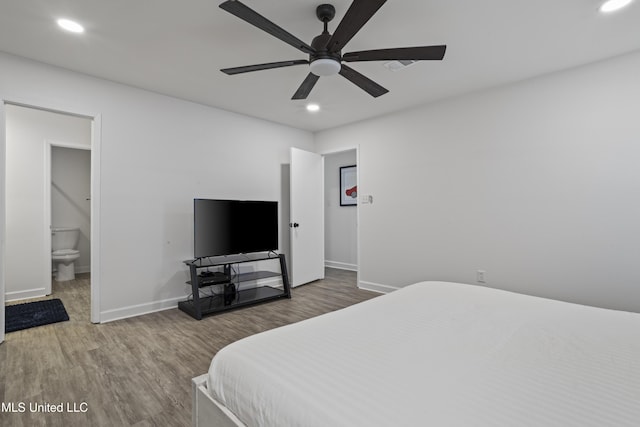 bedroom featuring recessed lighting, baseboards, and wood finished floors