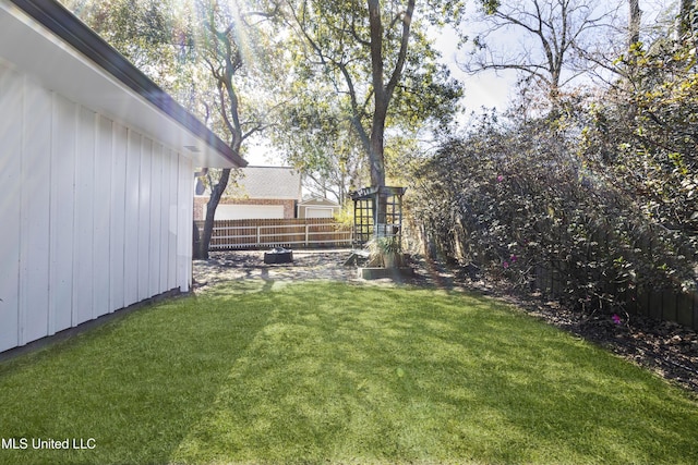 view of yard with a fenced backyard