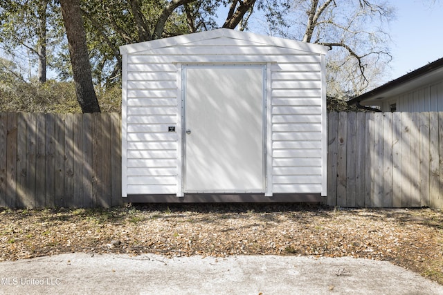 view of shed featuring a fenced backyard