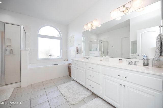 bathroom with vanity, tile patterned floors, and separate shower and tub