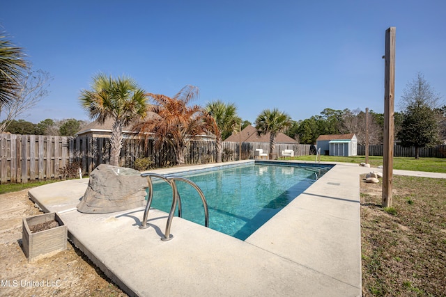 view of swimming pool with a patio area and a storage shed