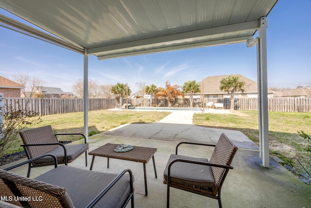 view of patio / terrace featuring a fenced in pool