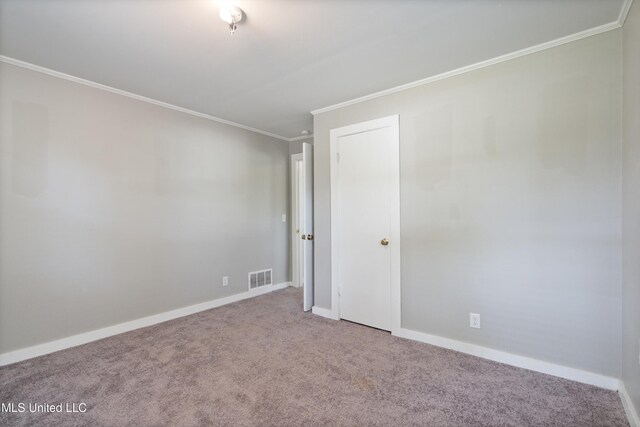 777 W Main St, Senatobia, MS 38668 - carpeted spare room featuring ornamental molding and baseboards