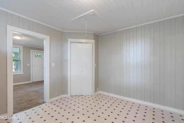 777 W Main St, Senatobia, MS 38668 - empty room featuring attic access, crown molding, and wooden walls