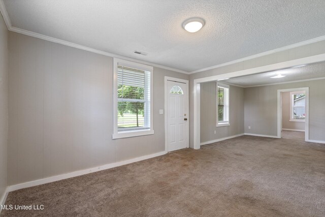 777 W Main St, Senatobia, MS 38668 - foyer entrance featuring ornamental molding, carpet, and a textured ceiling