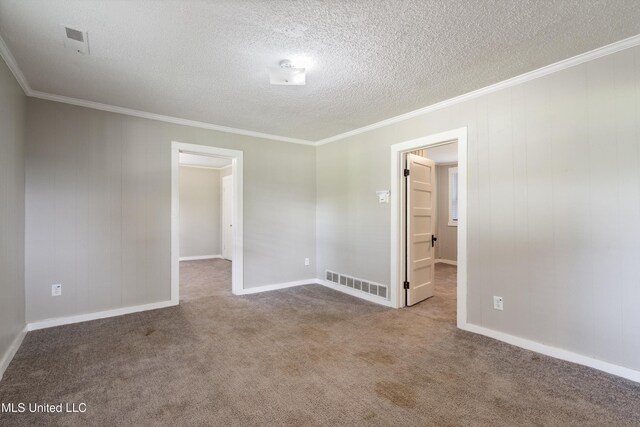 777 W Main St, Senatobia, MS 38668 - empty room featuring crown molding, carpet floors, and a textured ceiling