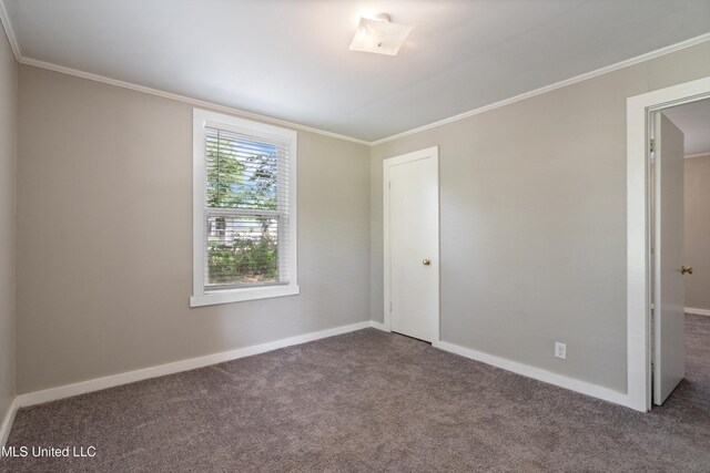 777 W Main St, Senatobia, MS 38668 - empty room featuring carpet floors and crown molding