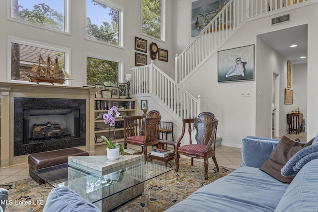 7395 Live Oak Way, Pass Christian, MS 39571 - living room with a towering ceiling, tile patterned flooring, stairway, baseboards, and recessed lighting
