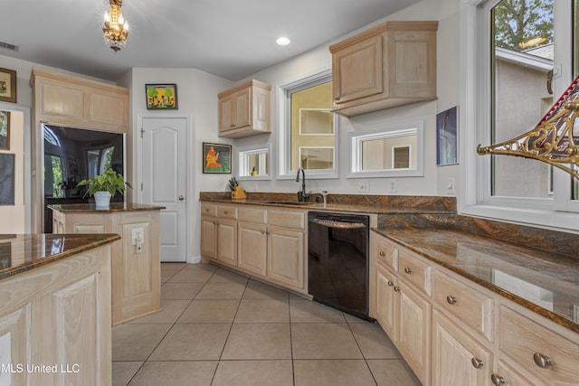 7395 Live Oak Way, Pass Christian, MS 39571 - kitchen with dishwasher, light brown cabinets, a sink, light tile patterned floors, and dark stone counters