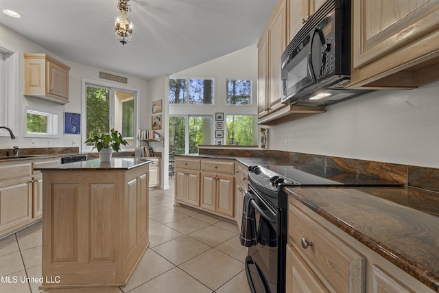 7395 Live Oak Way, Pass Christian, MS 39571 - kitchen with black appliances, light brown cabinetry, plenty of natural light, a sink, and lofted ceiling