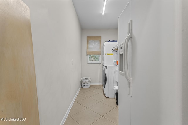 7395 Live Oak Way, Pass Christian, MS 39571 - laundry area featuring light tile patterned floors and baseboards