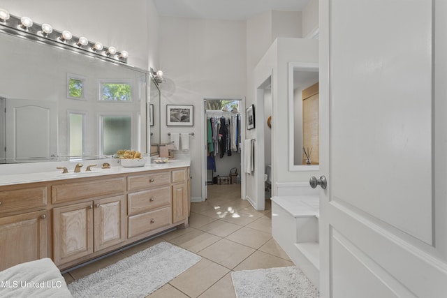 7395 Live Oak Way, Pass Christian, MS 39571 - full bath with tile patterned floors, vanity, a high ceiling, and a spacious closet