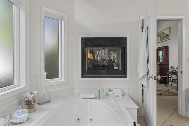 7395 Live Oak Way, Pass Christian, MS 39571 - bathroom featuring tile patterned flooring and a whirlpool tub