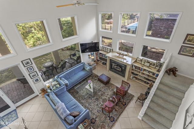 7395 Live Oak Way, Pass Christian, MS 39571 - living area with a towering ceiling, tile patterned floors, plenty of natural light, and ceiling fan