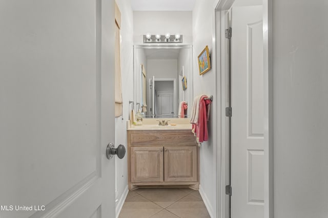 7395 Live Oak Way, Pass Christian, MS 39571 - bathroom with tile patterned flooring, vanity, and baseboards