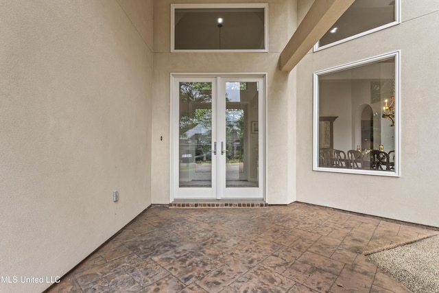 7395 Live Oak Way, Pass Christian, MS 39571 - property entrance with french doors, a patio, and stucco siding