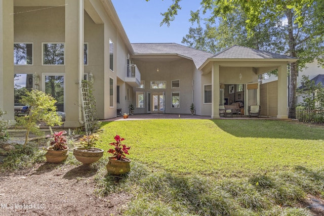 7395 Live Oak Way, Pass Christian, MS 39571 - rear view of property with stucco siding, a yard, and a patio area