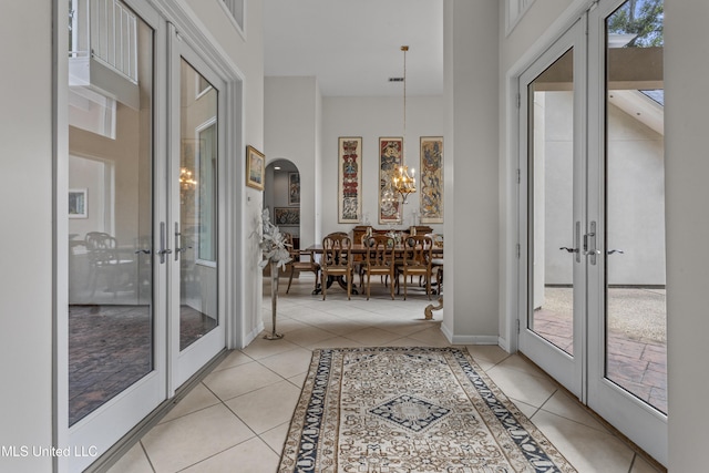 7395 Live Oak Way, Pass Christian, MS 39571 - interior space featuring french doors, arched walkways, and a chandelier