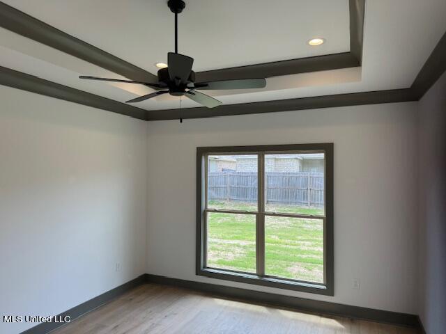 317 Willow Way Unit 158, Canton, MS 39046 - unfurnished room with recessed lighting, ceiling fan, a raised ceiling, baseboards, and wood finished floors