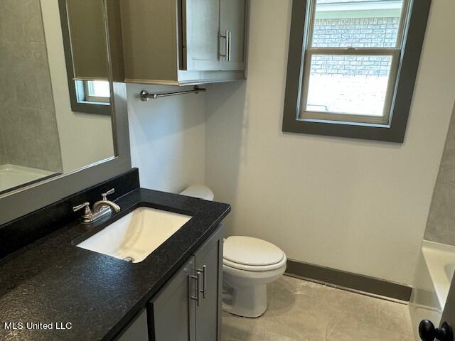 317 Willow Way Unit 158, Canton, MS 39046 - bathroom featuring toilet, vanity, and baseboards