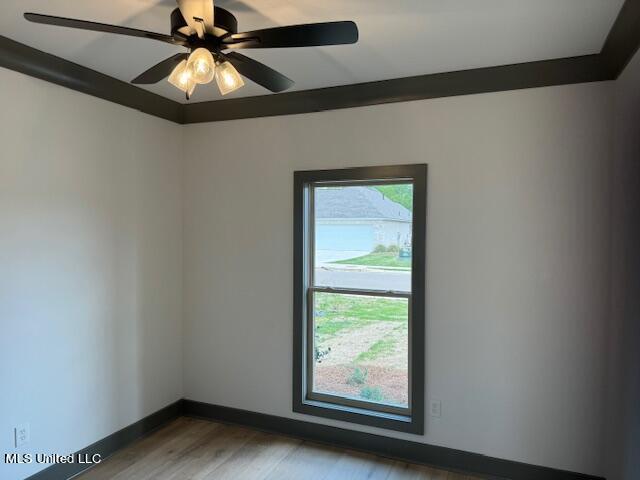 317 Willow Way Unit 158, Canton, MS 39046 - empty room with baseboards, wood finished floors, and ceiling fan