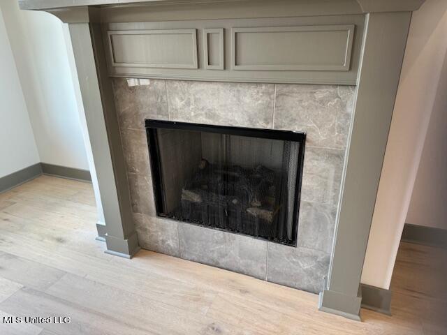 317 Willow Way Unit 158, Canton, MS 39046 - interior details featuring baseboards, wood finished floors, and a fireplace