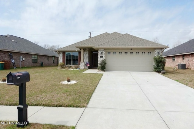 view of front of home with roof with shingles, central air condition unit, concrete driveway, a front yard, and a garage