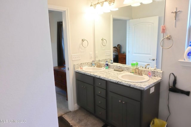 bathroom featuring double vanity and a sink