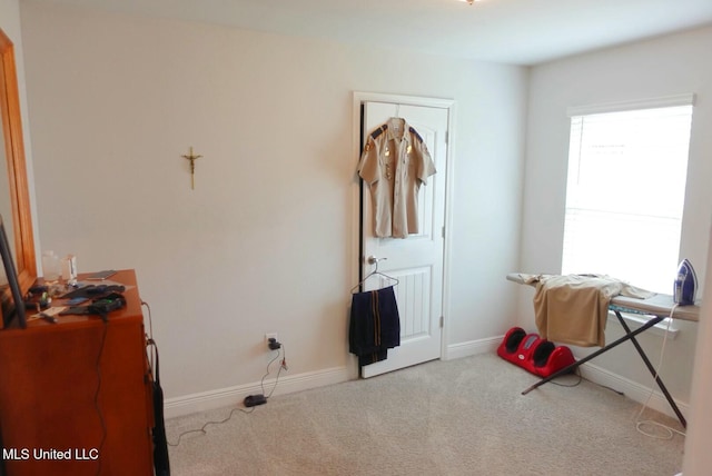 carpeted bedroom with baseboards